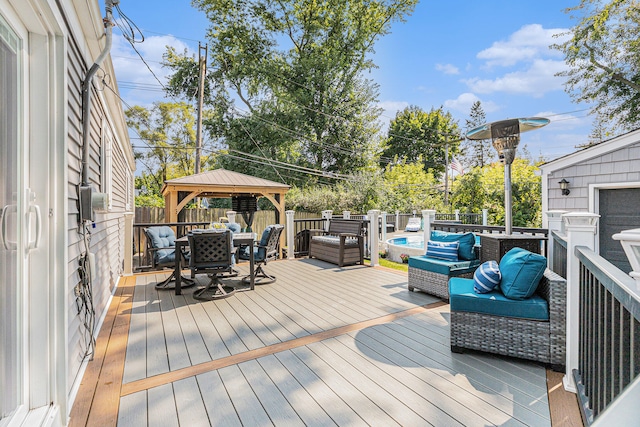 deck featuring a gazebo and outdoor lounge area