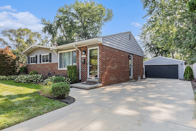 view of front facade with a garage, an outdoor structure, and a front lawn