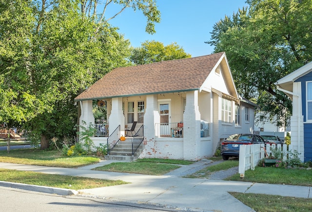 bungalow-style house featuring covered porch