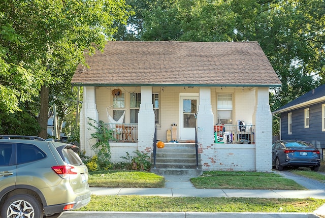 bungalow-style house featuring covered porch