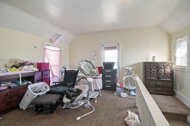 bedroom featuring dark colored carpet and vaulted ceiling