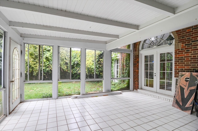 unfurnished sunroom with french doors and beam ceiling