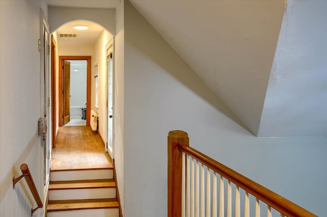 staircase featuring wood-type flooring