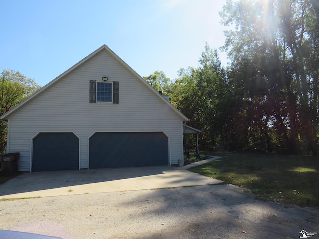 view of side of home with a garage