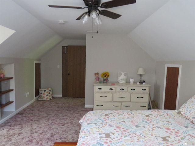 bedroom with ceiling fan, lofted ceiling, and light carpet