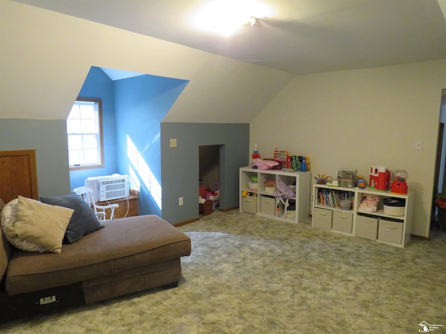 game room with a wall mounted air conditioner, carpet, and vaulted ceiling