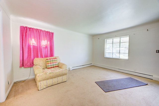 sitting room featuring carpet and a baseboard radiator