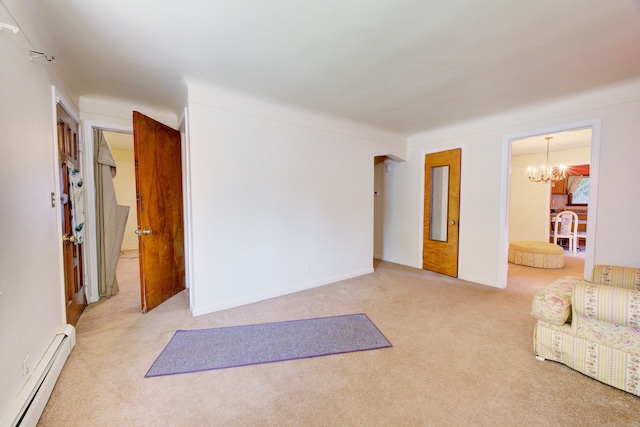 interior space featuring an inviting chandelier, carpet, and a baseboard heating unit