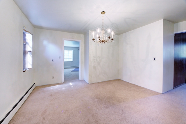 carpeted spare room featuring a baseboard heating unit and a notable chandelier