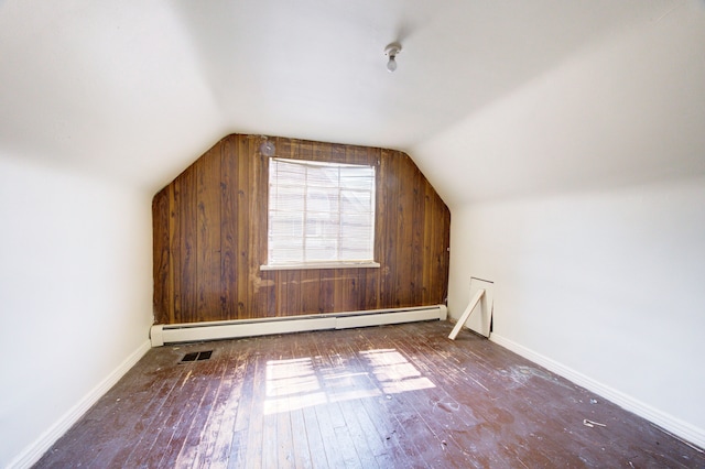 bonus room with hardwood / wood-style floors, a baseboard radiator, and lofted ceiling