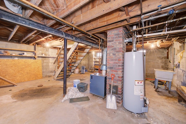 basement with gas water heater and sink