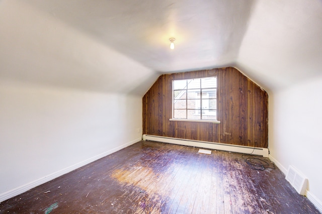 bonus room with dark hardwood / wood-style floors, lofted ceiling, and baseboard heating