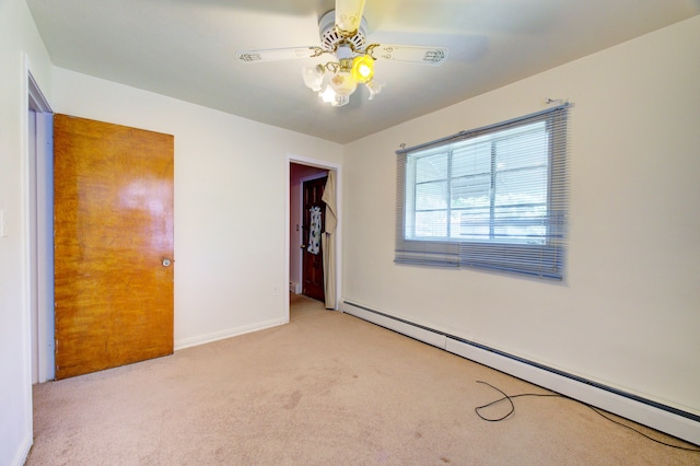 unfurnished bedroom with baseboard heating, ceiling fan, and light carpet