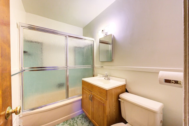 full bathroom featuring shower / bath combination with glass door, vanity, and toilet