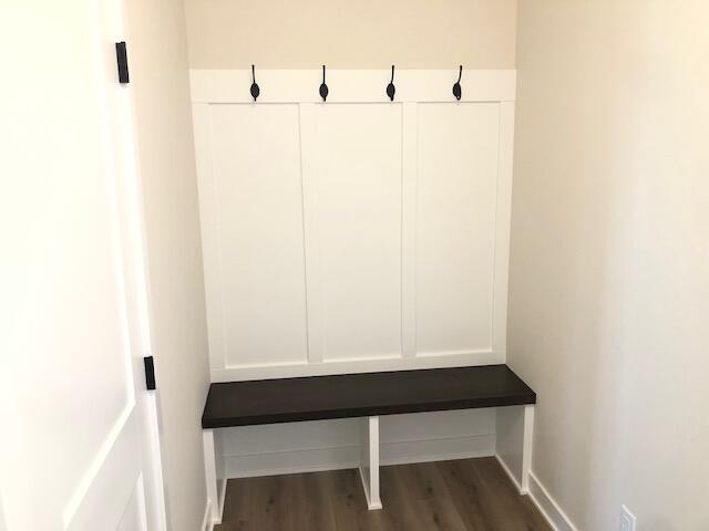 mudroom with dark wood-type flooring