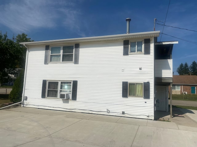 view of home's exterior with cooling unit