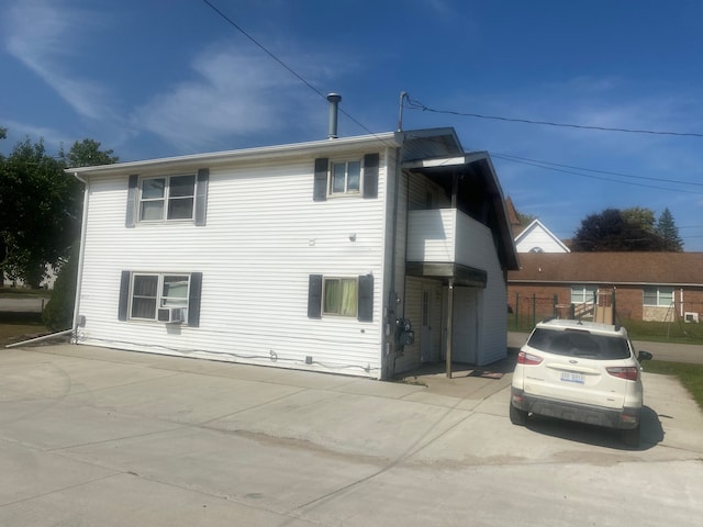 view of side of property with cooling unit