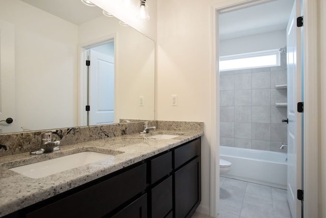 full bathroom with tile patterned flooring, vanity, toilet, and tiled shower / bath combo