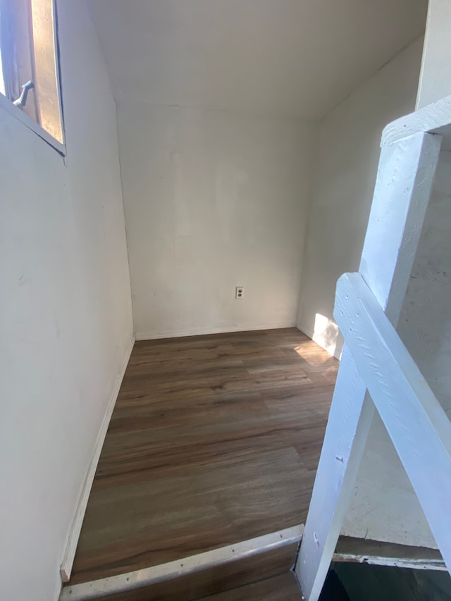 unfurnished room featuring dark hardwood / wood-style flooring