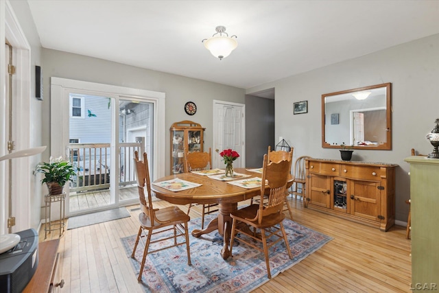 dining space featuring light wood-type flooring