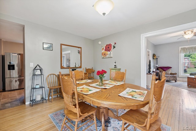 dining room featuring ceiling fan and wood-type flooring