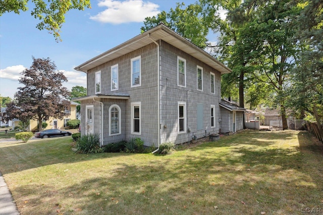 view of home's exterior featuring a lawn