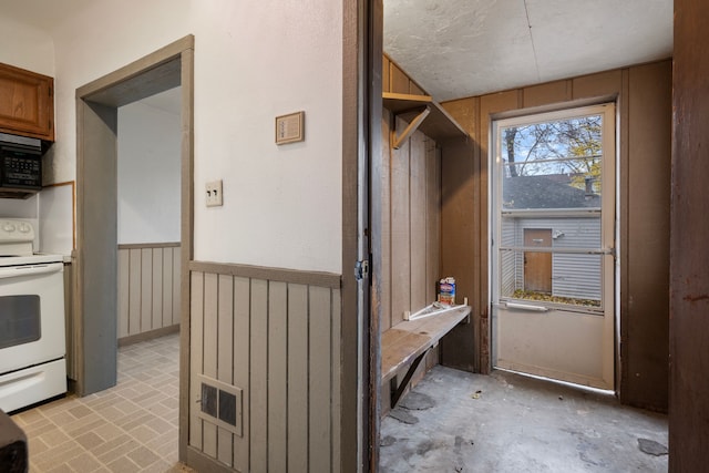 interior space featuring wooden walls