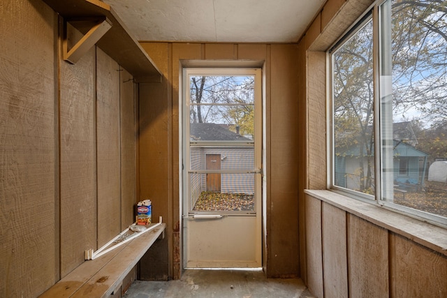 mudroom with wooden walls