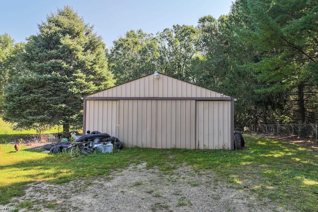 view of outdoor structure with a lawn