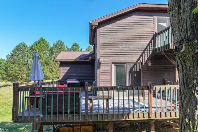 back of house with a wooden deck