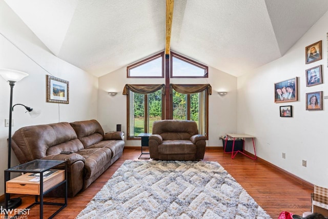 living room with vaulted ceiling with beams and wood-type flooring