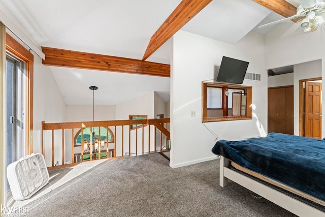 carpeted bedroom with vaulted ceiling with beams, ceiling fan, and a closet