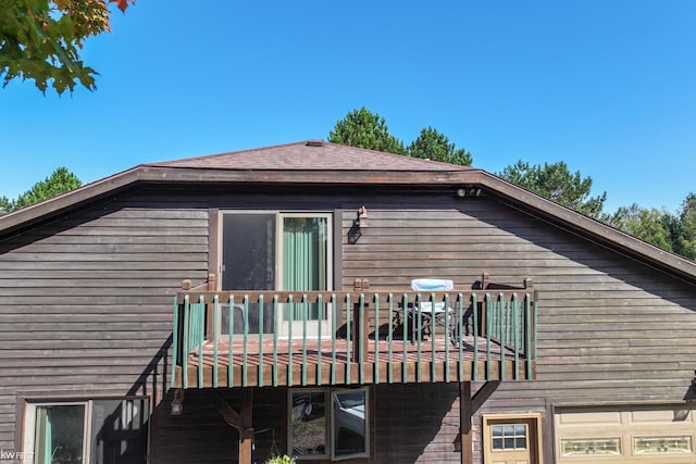 view of side of property featuring a balcony