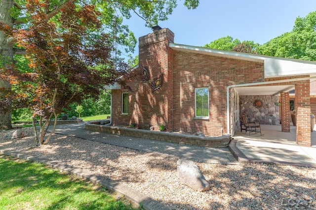 view of home's exterior with a patio