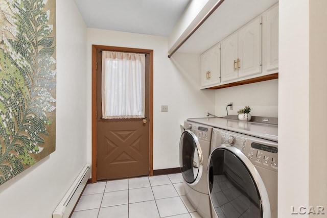 laundry room with cabinets, light tile patterned floors, a baseboard radiator, and separate washer and dryer