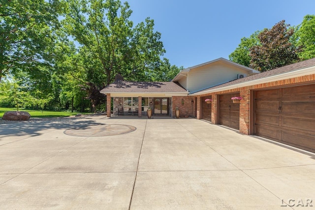 view of front of house with a porch and a garage