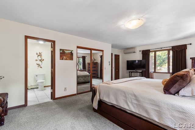 bedroom with light carpet, ensuite bathroom, an AC wall unit, and a baseboard heating unit