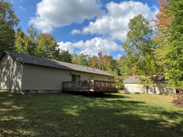 9996 N Chippewa Rd, Coleman, MI 48618 - rear view of property featuring a wooden deck, a lawn, and crawl space