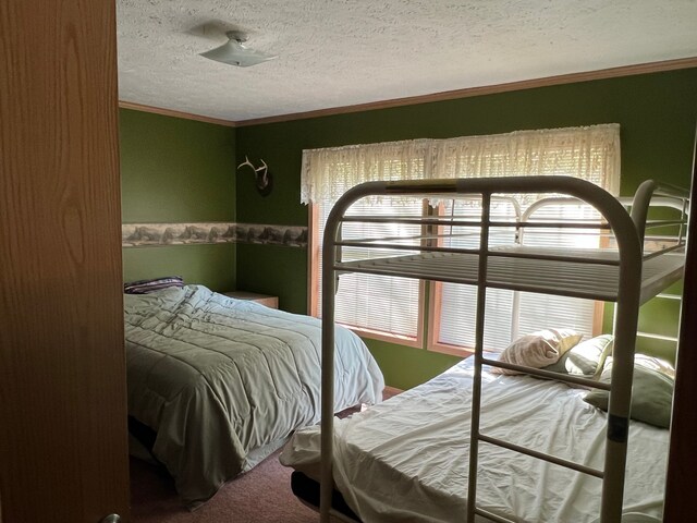 9996 N Chippewa Rd, Coleman, MI 48618 - carpeted bedroom with a textured ceiling and crown molding