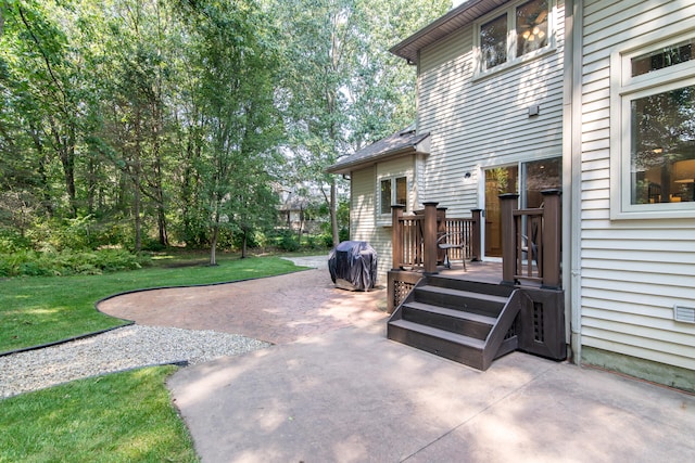 view of patio / terrace featuring a grill and a wooden deck