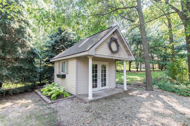 view of outbuilding with french doors and cooling unit