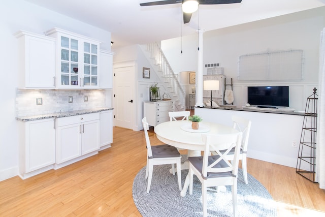 dining room featuring light hardwood / wood-style floors and ceiling fan