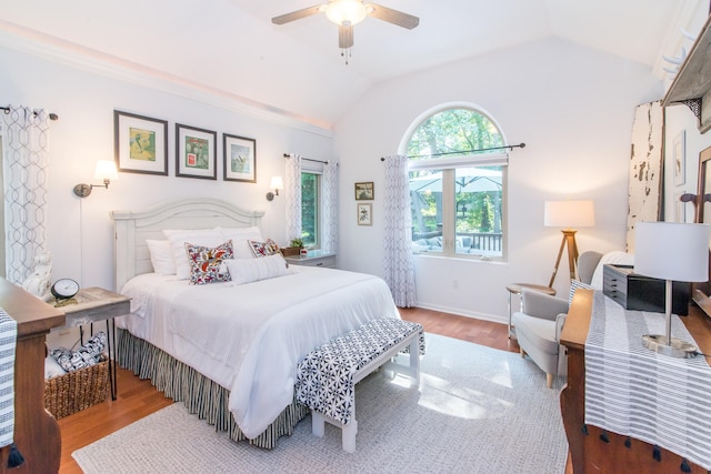 bedroom featuring wood-type flooring, ceiling fan, and lofted ceiling