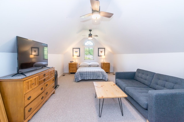 carpeted bedroom featuring ceiling fan and vaulted ceiling