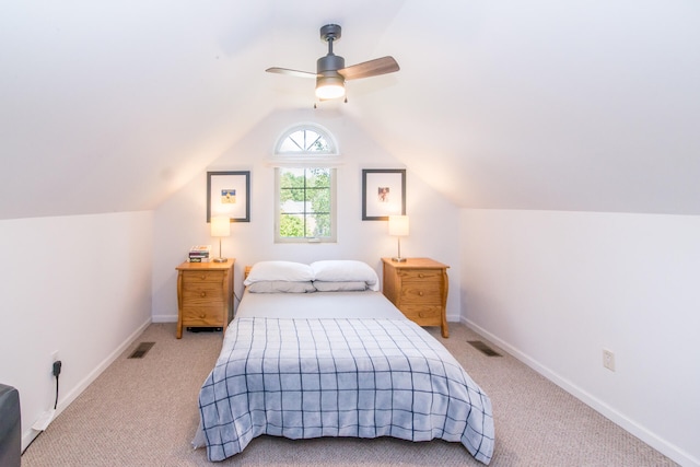 bedroom featuring ceiling fan, light carpet, and vaulted ceiling