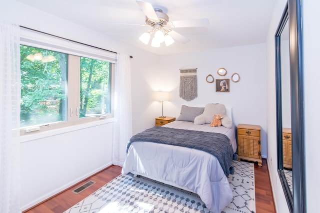 bedroom featuring hardwood / wood-style floors and ceiling fan