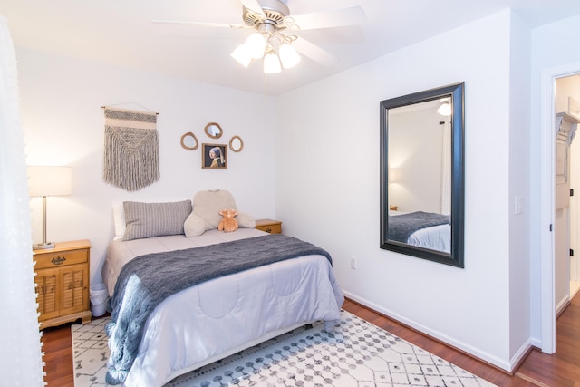 bedroom featuring hardwood / wood-style flooring and ceiling fan