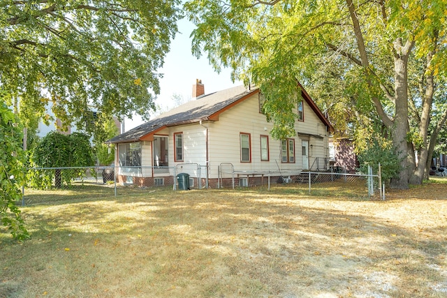 view of property exterior with a lawn and cooling unit