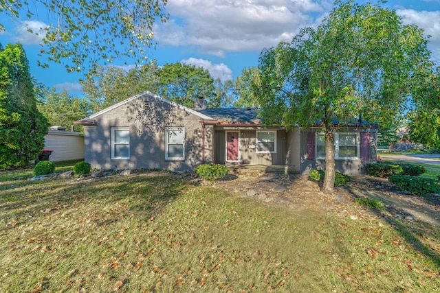 ranch-style house with a front lawn