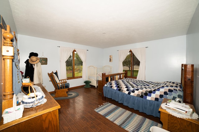 21493 20 Mile Rd, Tustin, MI 49688 - bedroom with multiple windows and hardwood / wood-style floors